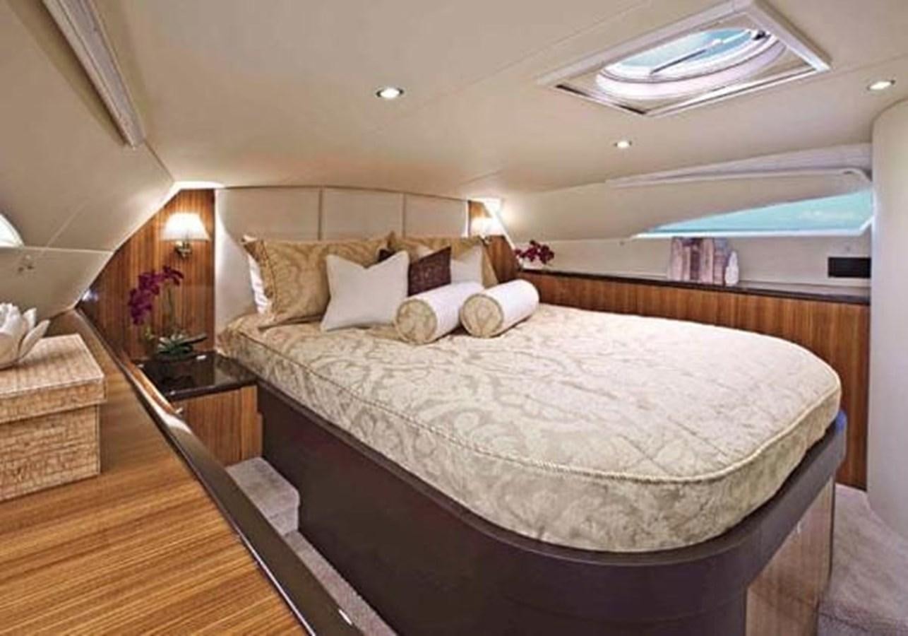 a large bed in a hotel room aboard 2010 CUSTOM AXCELL  650 POWER CATAMARAN Yacht for Sale