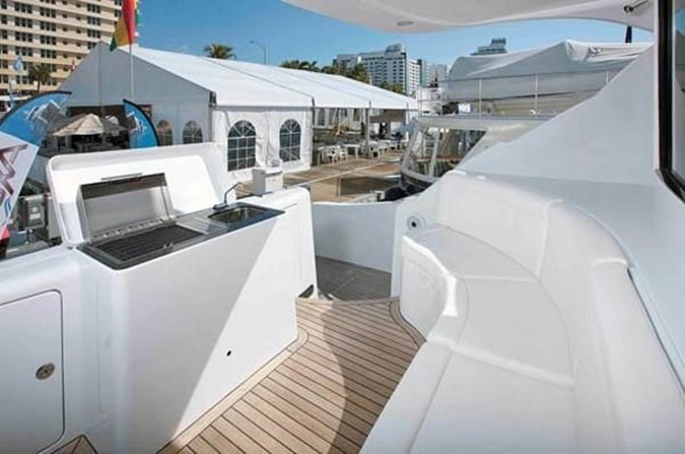 a boat deck with several white boats aboard 2010 CUSTOM AXCELL  650 POWER CATAMARAN Yacht for Sale