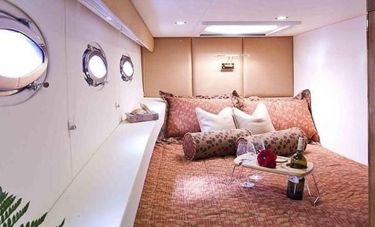 a living room with a couch and a table aboard 2010 CUSTOM AXCELL  650 POWER CATAMARAN Yacht for Sale
