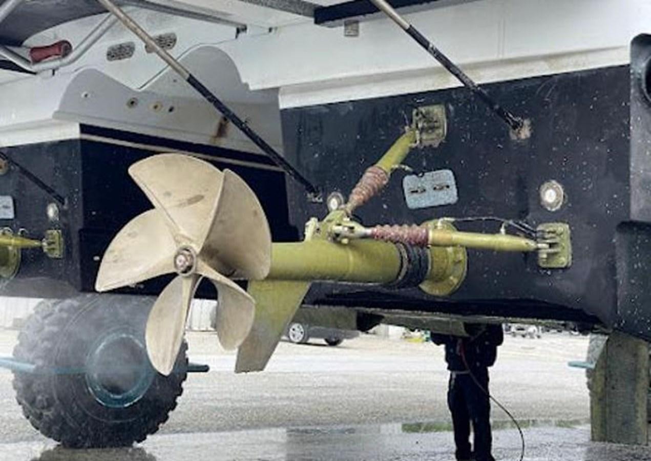 a military vehicle with a person standing on the front aboard 2010 CUSTOM AXCELL  650 POWER CATAMARAN Yacht for Sale