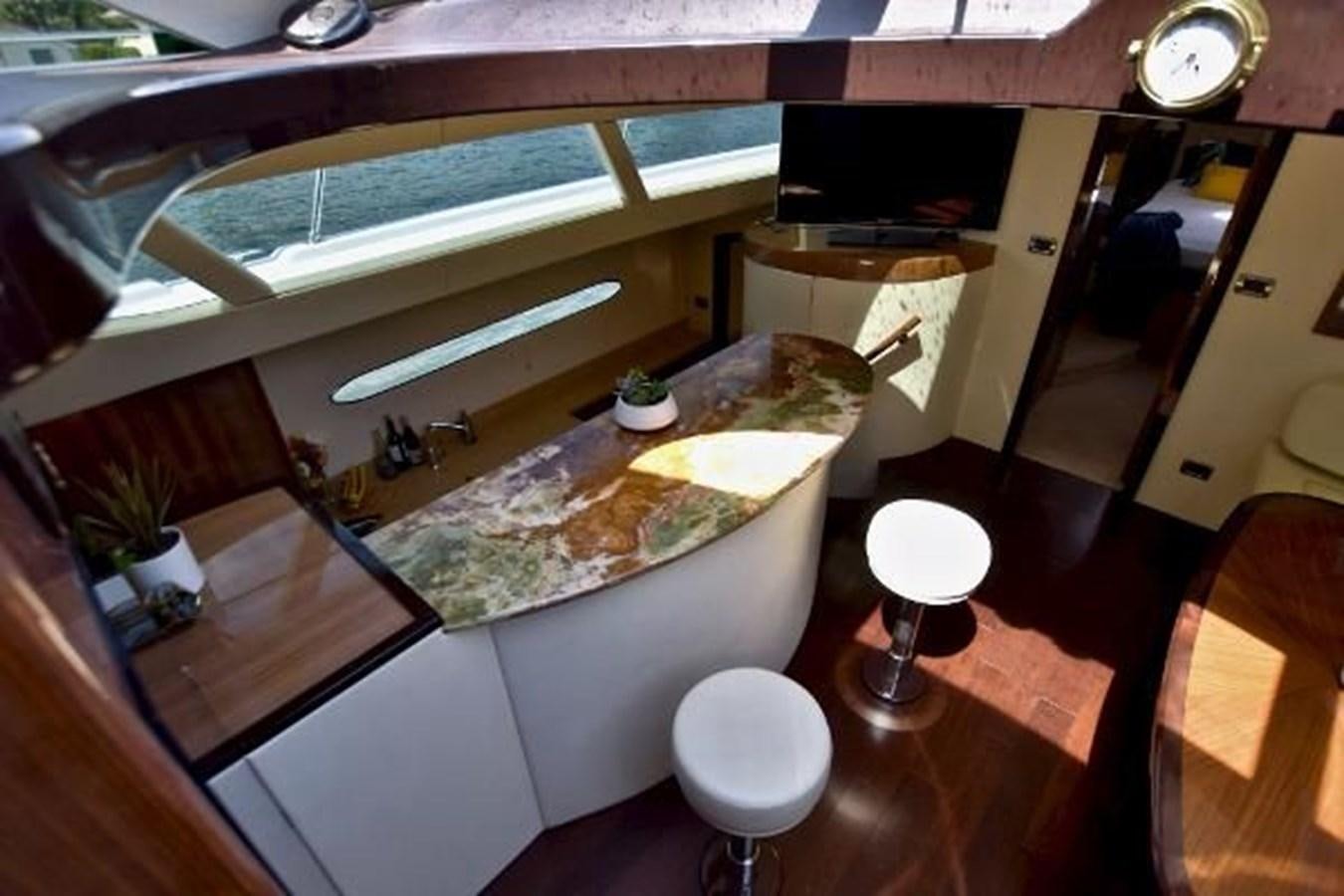 a kitchen with a large glass window aboard 2010 CUSTOM AXCELL  650 POWER CATAMARAN Yacht for Sale