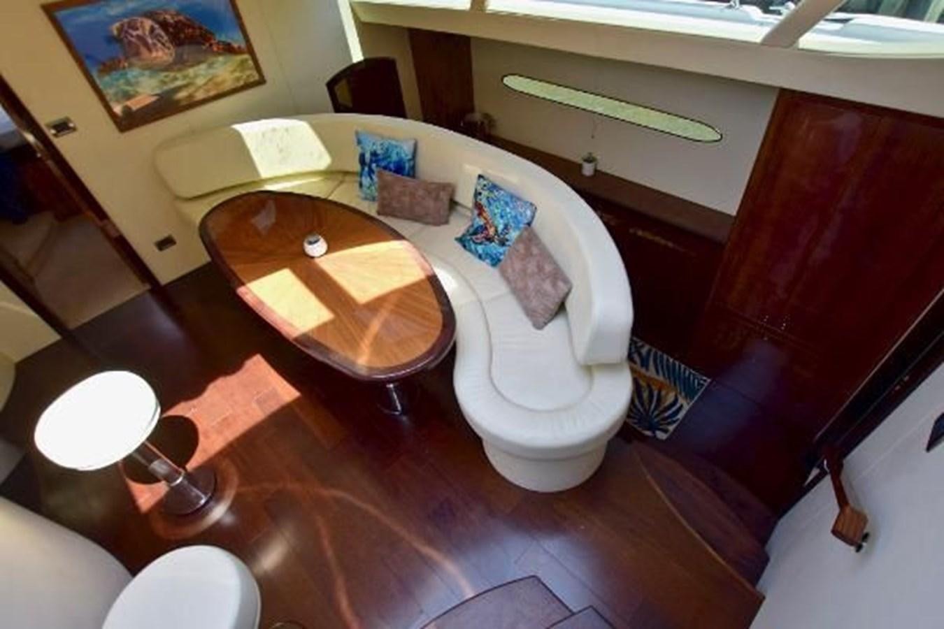 a room with a table and chairs aboard 2010 CUSTOM AXCELL  650 POWER CATAMARAN Yacht for Sale