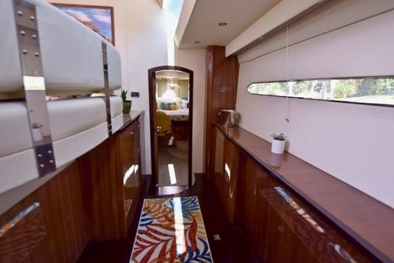 a kitchen with a counter and cabinets aboard 2010 CUSTOM AXCELL  650 POWER CATAMARAN Yacht for Sale