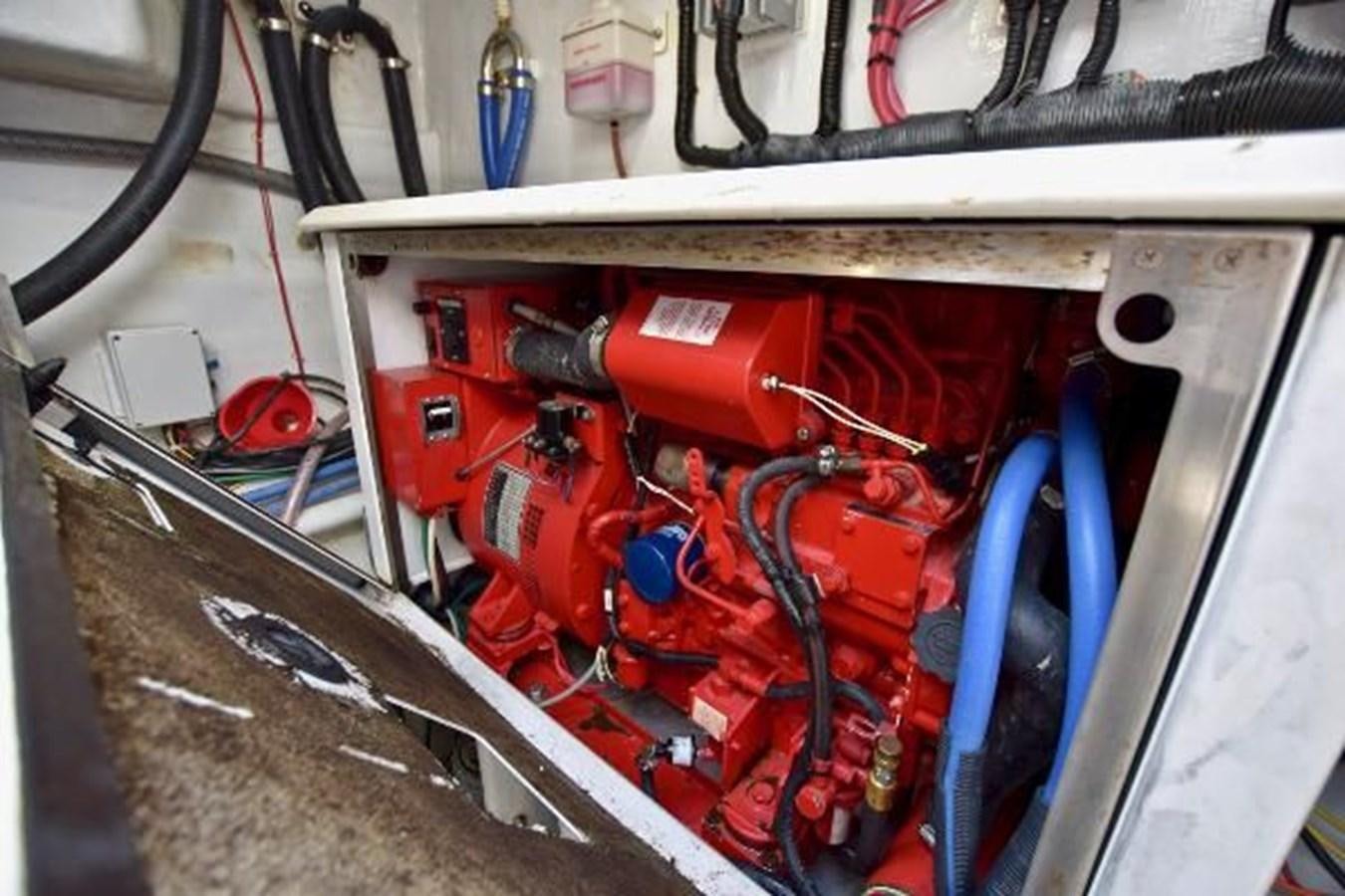 a car engine with red wires aboard 2010 CUSTOM AXCELL  650 POWER CATAMARAN Yacht for Sale