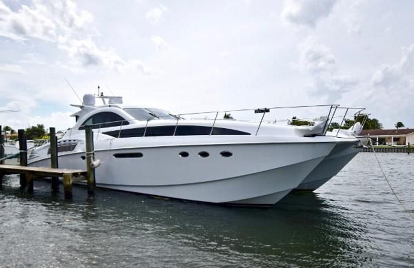 a white yacht docked at a dock aboard 2010 CUSTOM AXCELL  650 POWER CATAMARAN Yacht for Sale