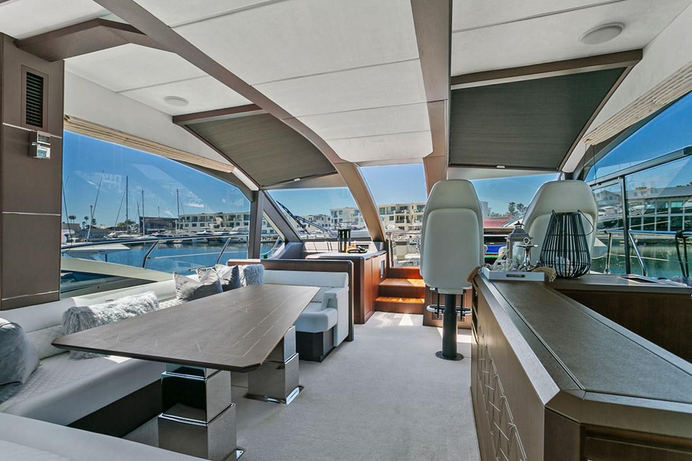 a room with a table and chairs aboard NOKOKO Yacht for Sale