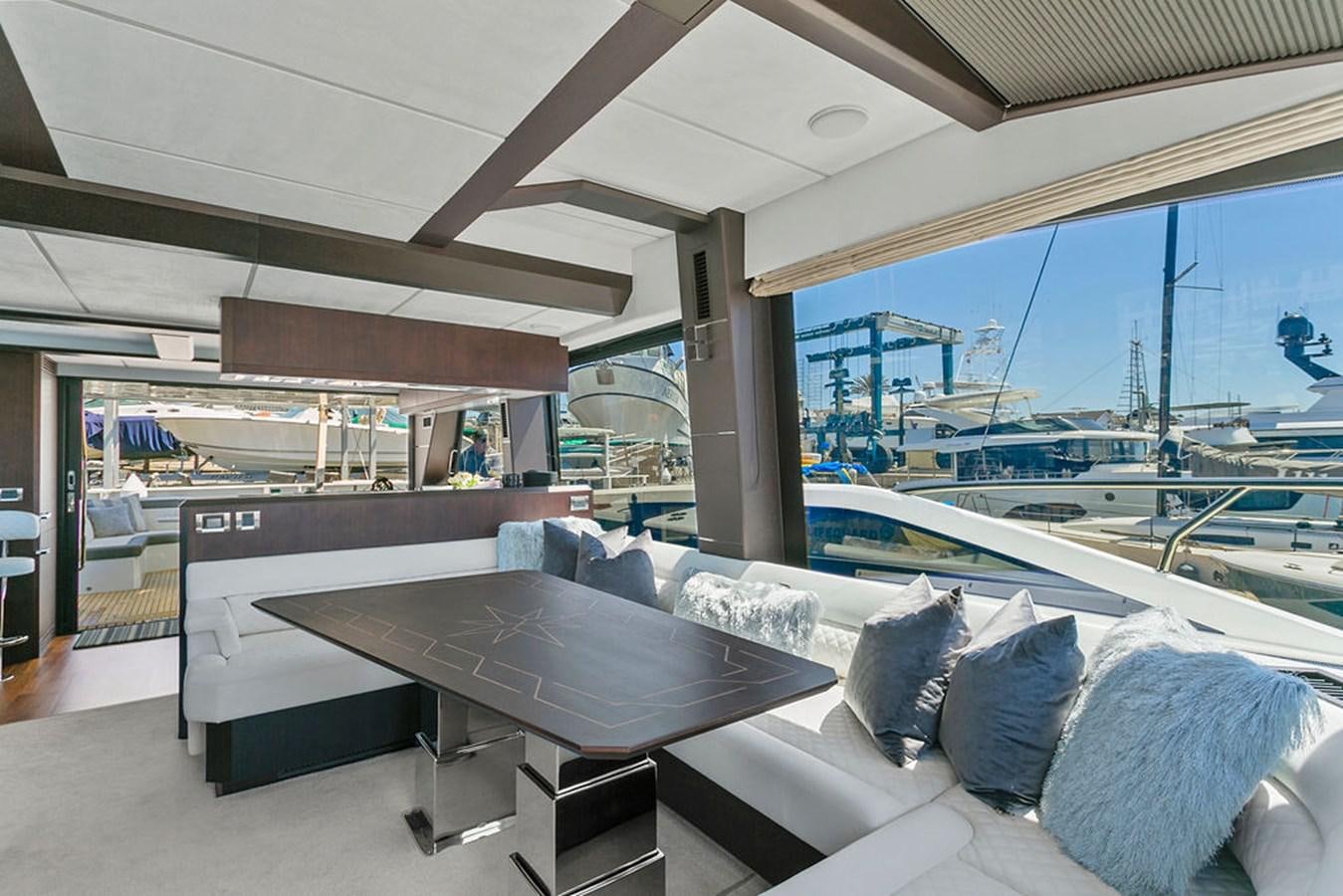a room with a couch and a table aboard NOKOKO Yacht for Sale