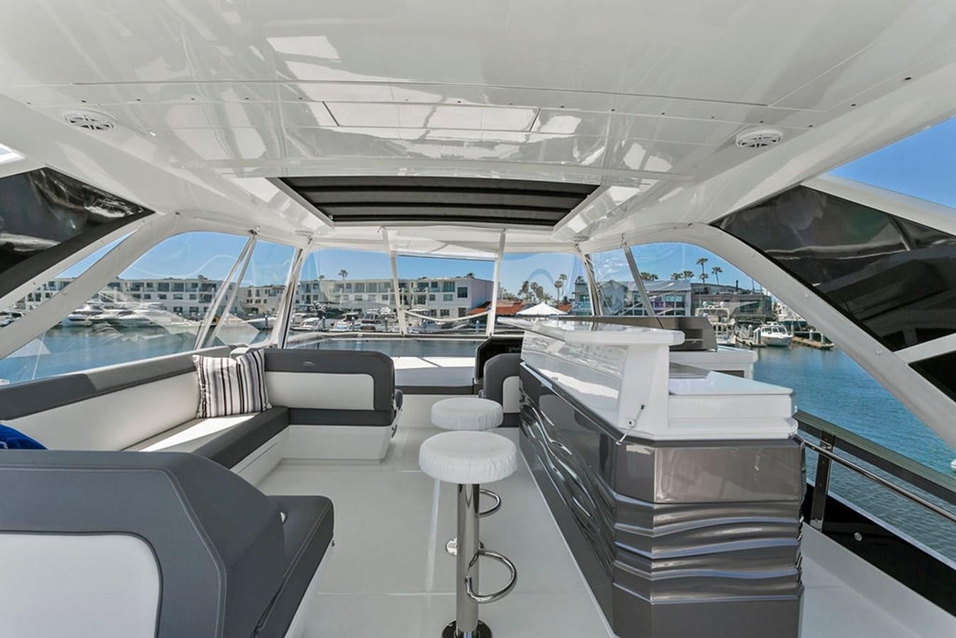 a boat with a view of the water and the city below aboard NOKOKO Yacht for Sale