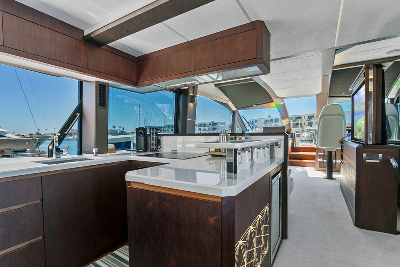 a kitchen with a large island aboard NOKOKO Yacht for Sale