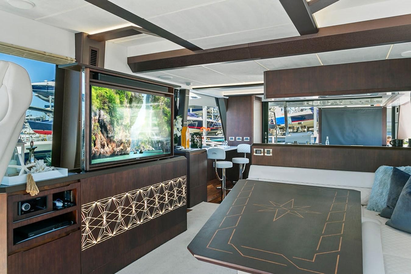 a room with a large window and a large rug aboard NOKOKO Yacht for Sale