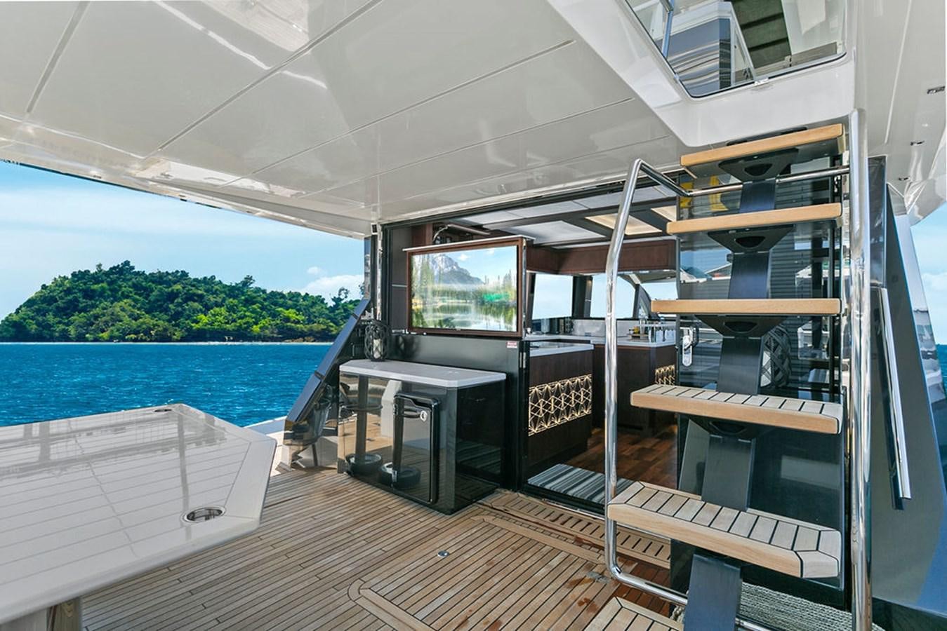 a boat with a deck and a large window aboard NOKOKO Yacht for Sale