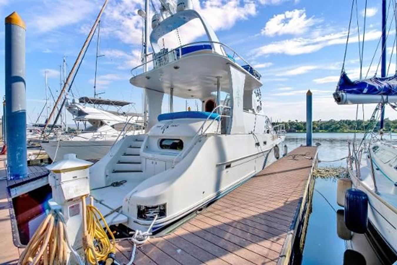 a large white boat docked aboard DREAM CATCHER Yacht for Sale