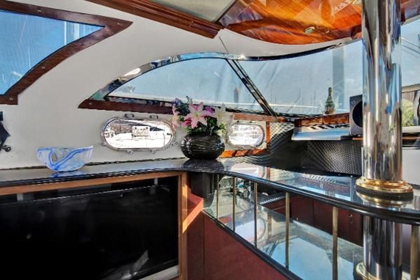 a glass umbrella on a table aboard DREAM CATCHER Yacht for Sale