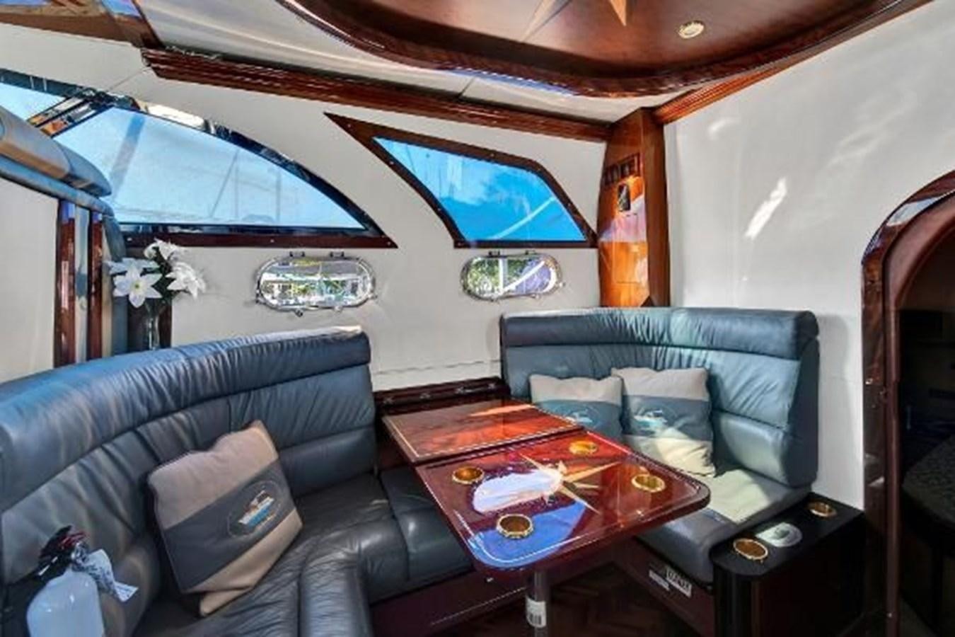 a living room with a couch and a table aboard DREAM CATCHER Yacht for Sale