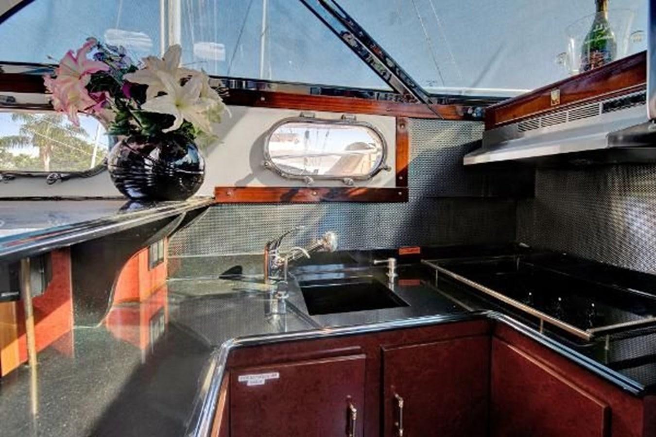 a kitchen with a sink and a mirror aboard DREAM CATCHER Yacht for Sale