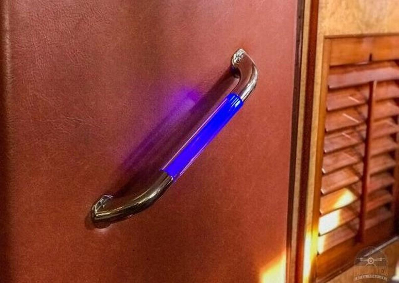 a purple handled scissors on a table aboard DREAM CATCHER Yacht for Sale