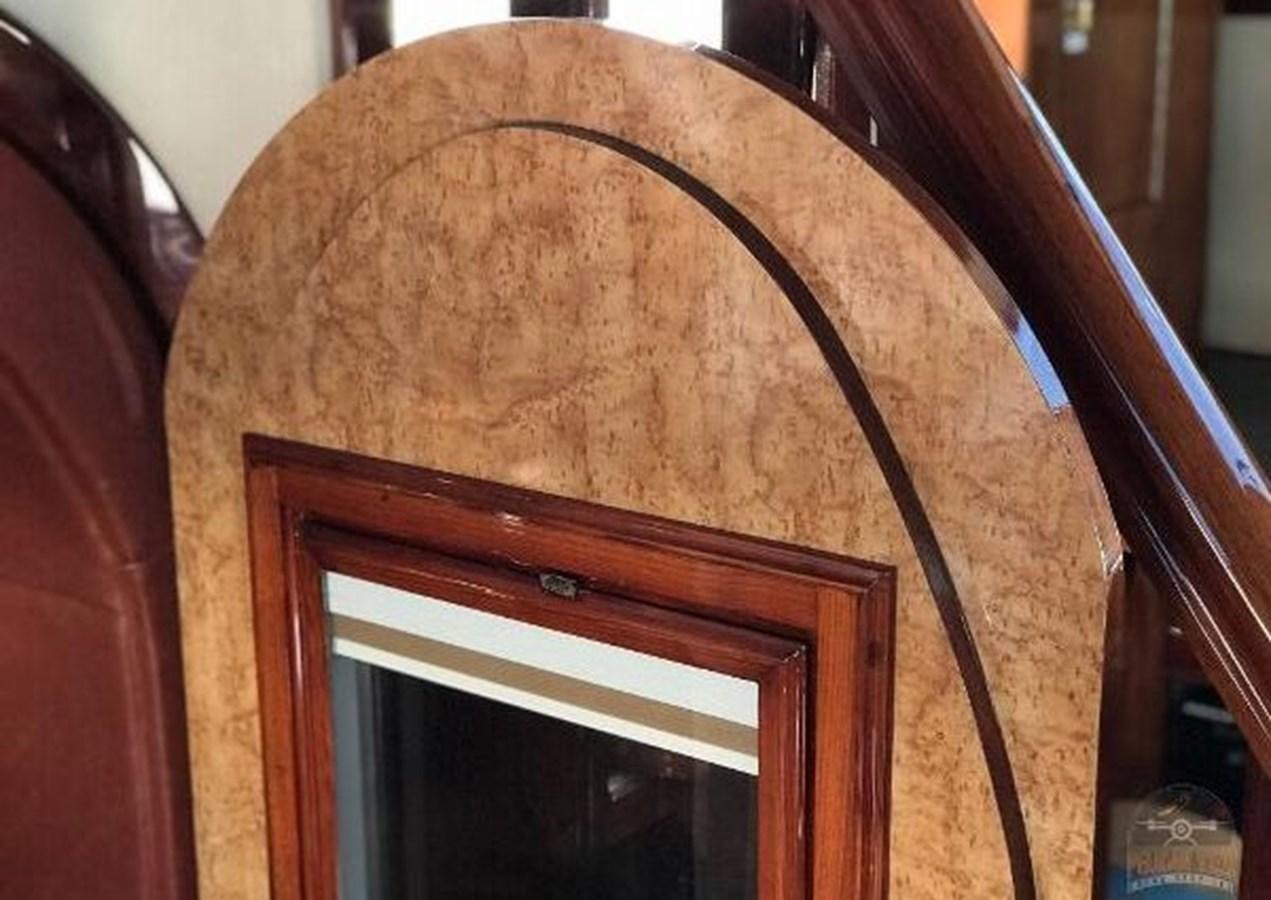 a wooden door with a round wooden frame aboard DREAM CATCHER Yacht for Sale