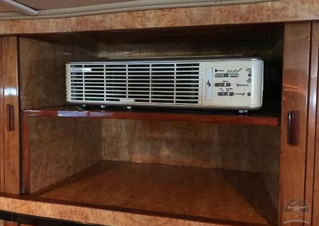 a microwave oven with a sign on the door aboard DREAM CATCHER Yacht for Sale