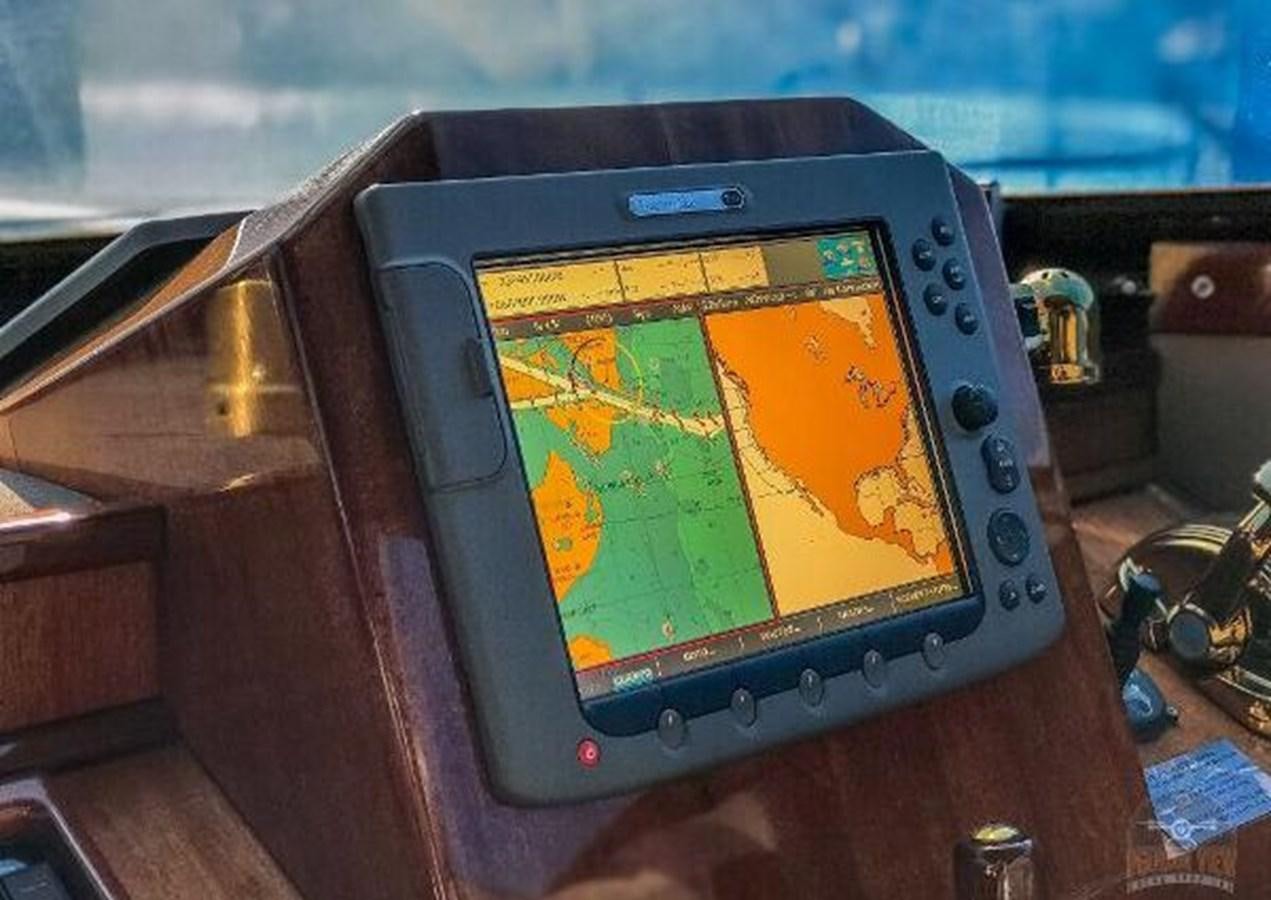 a tablet with a world map on it aboard DREAM CATCHER Yacht for Sale