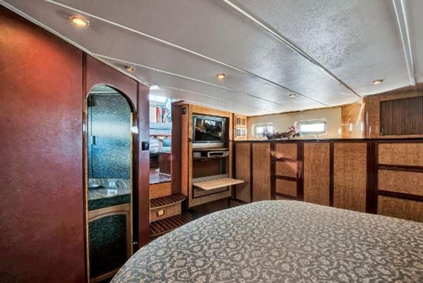 a bedroom with a large bed aboard DREAM CATCHER Yacht for Sale