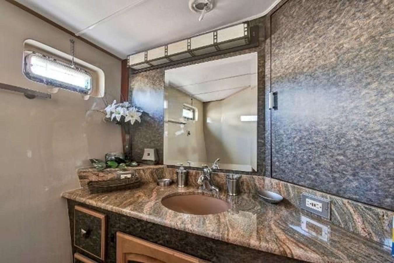 a bathroom with a large mirror aboard DREAM CATCHER Yacht for Sale