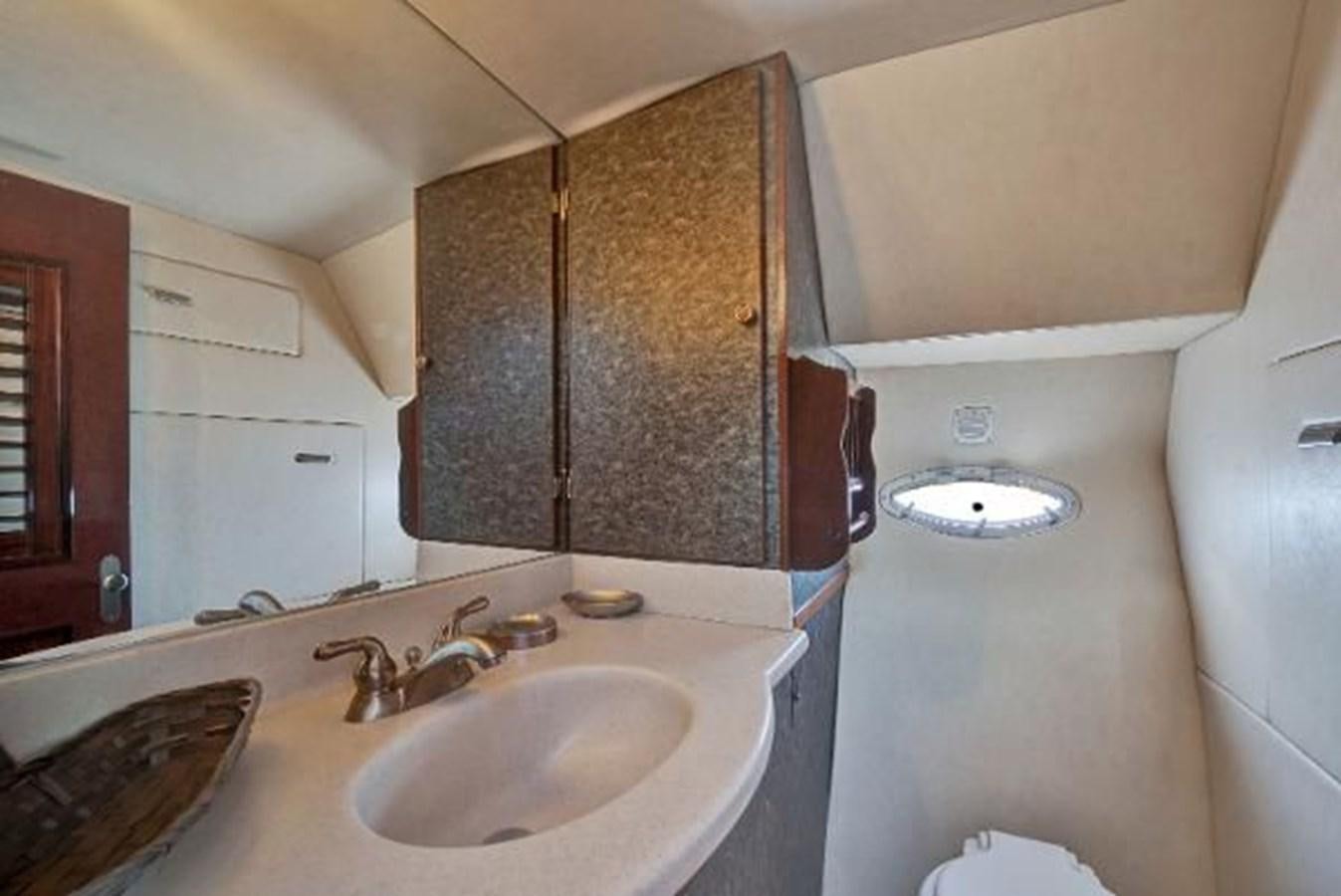 a bathroom with a sink and a mirror aboard DREAM CATCHER Yacht for Sale