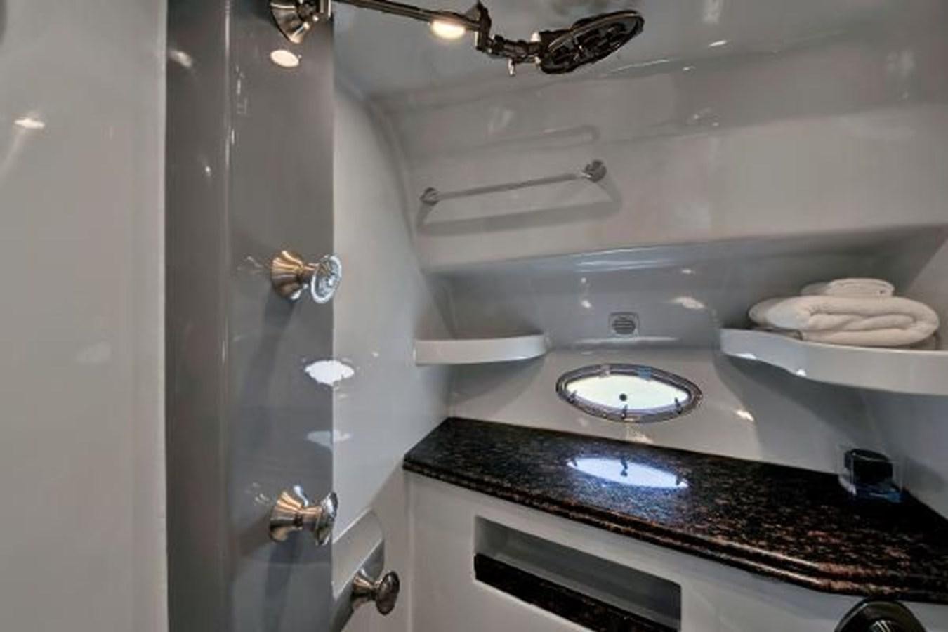 a bathroom with a sink and a mirror aboard DREAM CATCHER Yacht for Sale