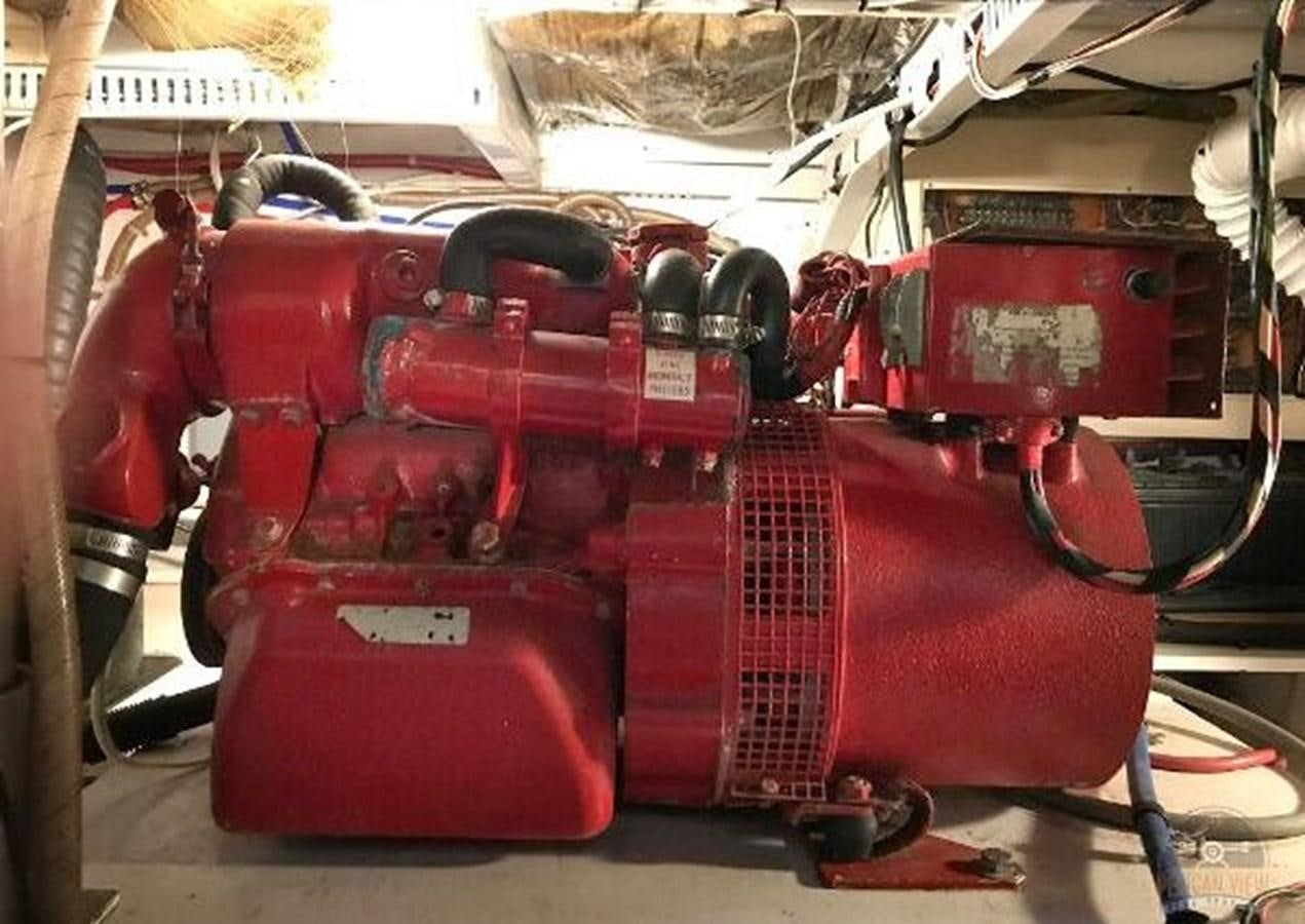 a red car with a large red trunk aboard DREAM CATCHER Yacht for Sale