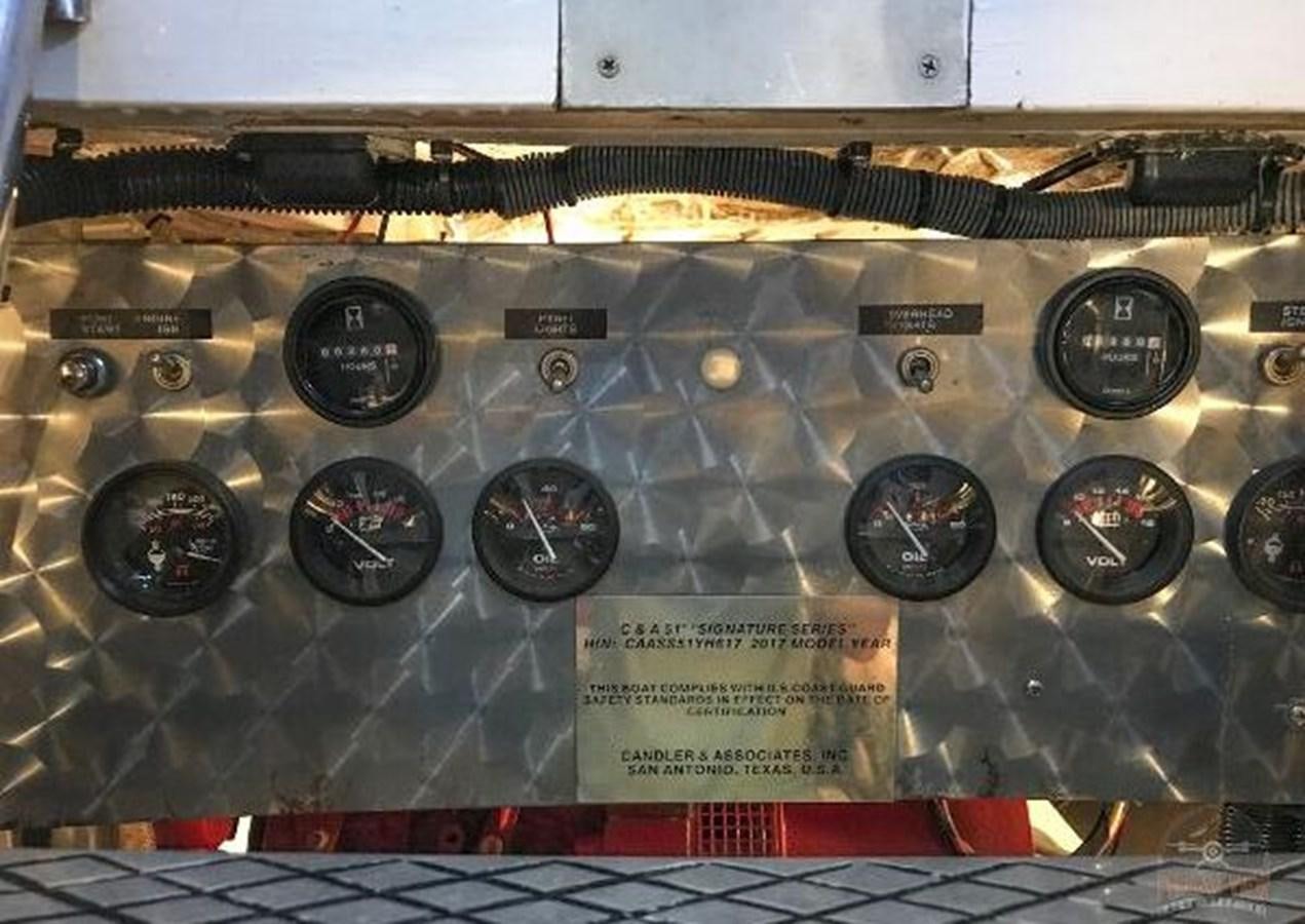 a group of black and silver radio drives on a shelf aboard DREAM CATCHER Yacht for Sale