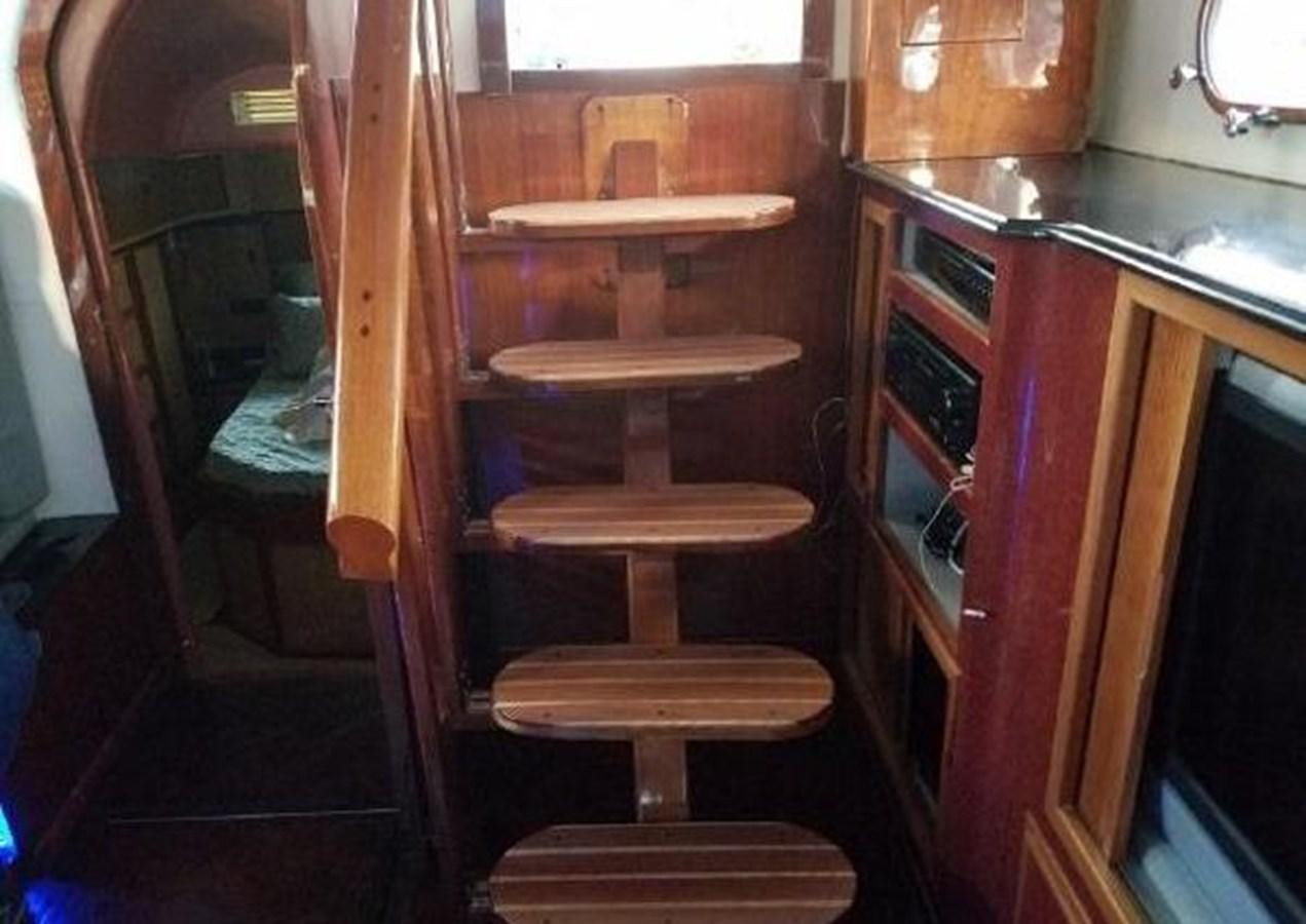 a wooden chair in a room aboard DREAM CATCHER Yacht for Sale