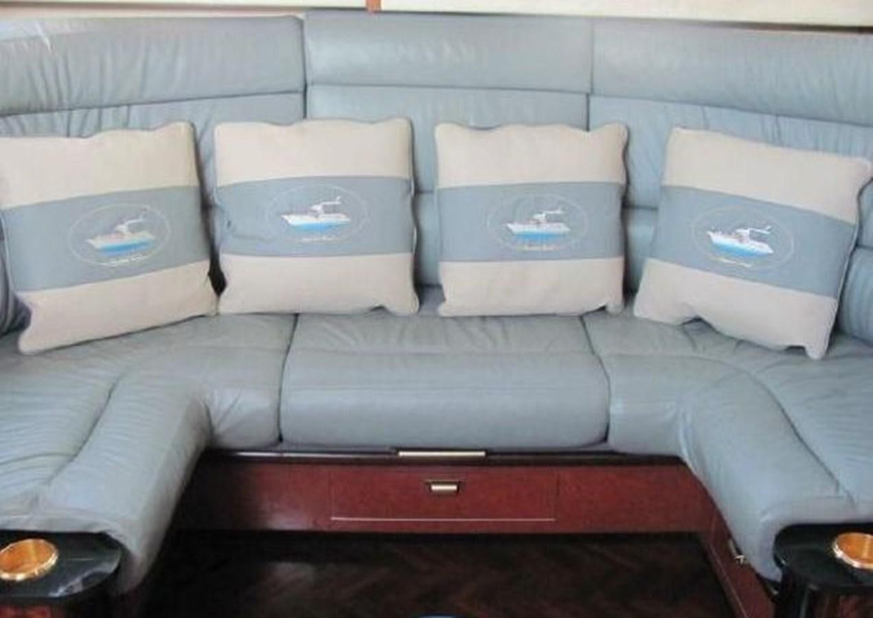 a group of white pillows on a couch aboard DREAM CATCHER Yacht for Sale