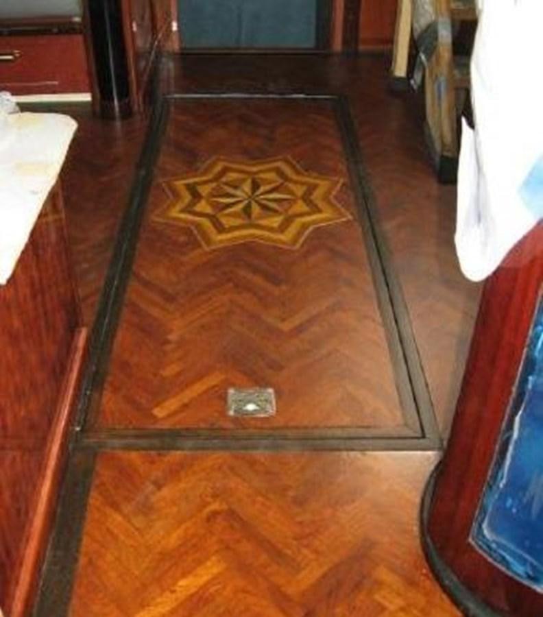 a wooden floor with a hole in it aboard DREAM CATCHER Yacht for Sale