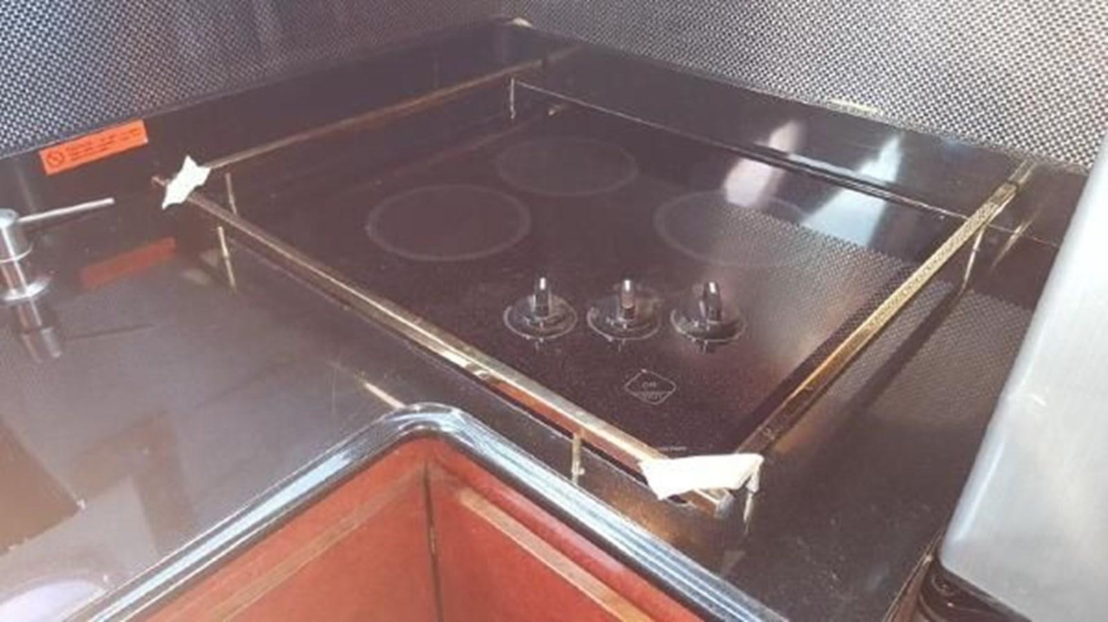 a stove with a pan on it aboard DREAM CATCHER Yacht for Sale