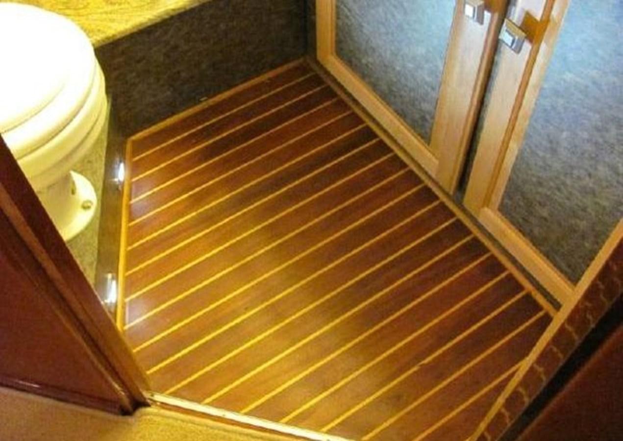 a wooden floor with a toilet aboard DREAM CATCHER Yacht for Sale