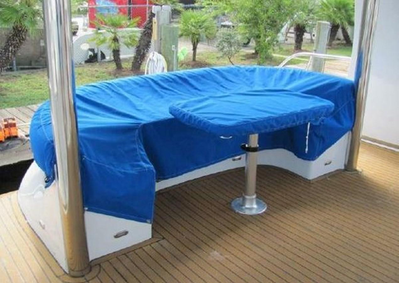 a blue bed on a deck aboard DREAM CATCHER Yacht for Sale