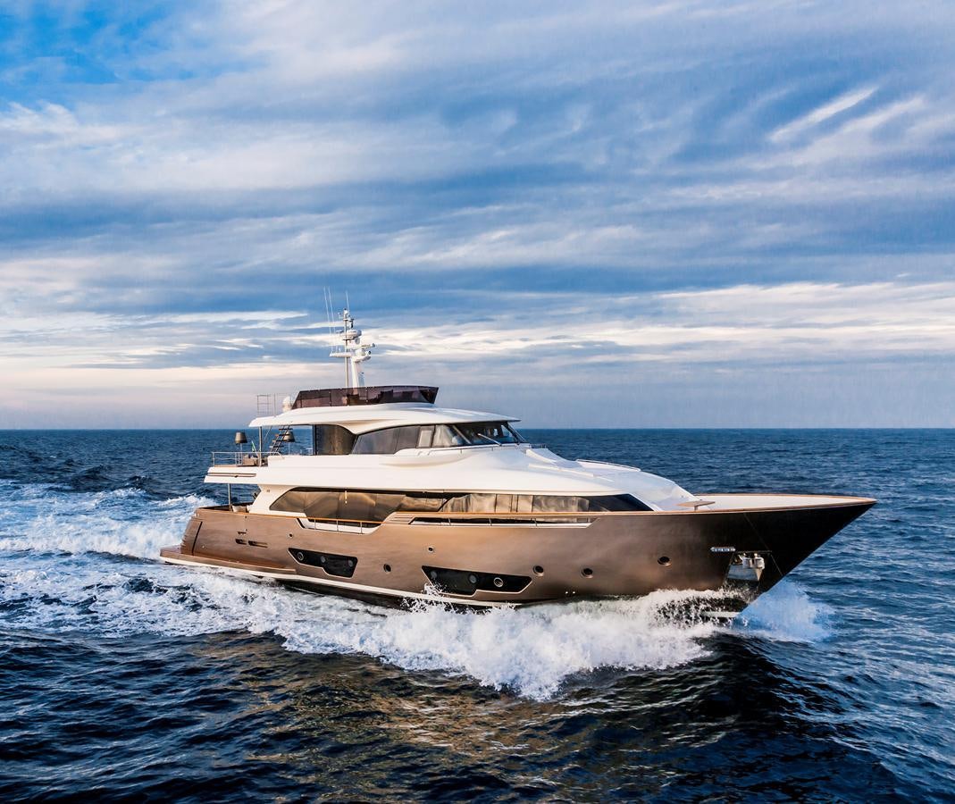 a white yacht on the water aboard YVONNE Yacht for Sale