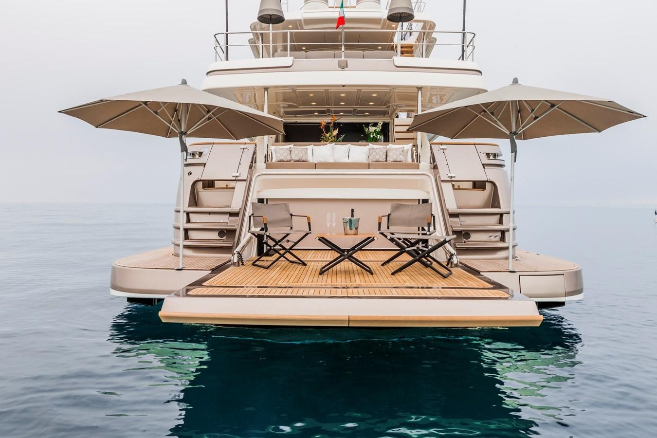 a boat with a table and chairs on it aboard YVONNE Yacht for Sale