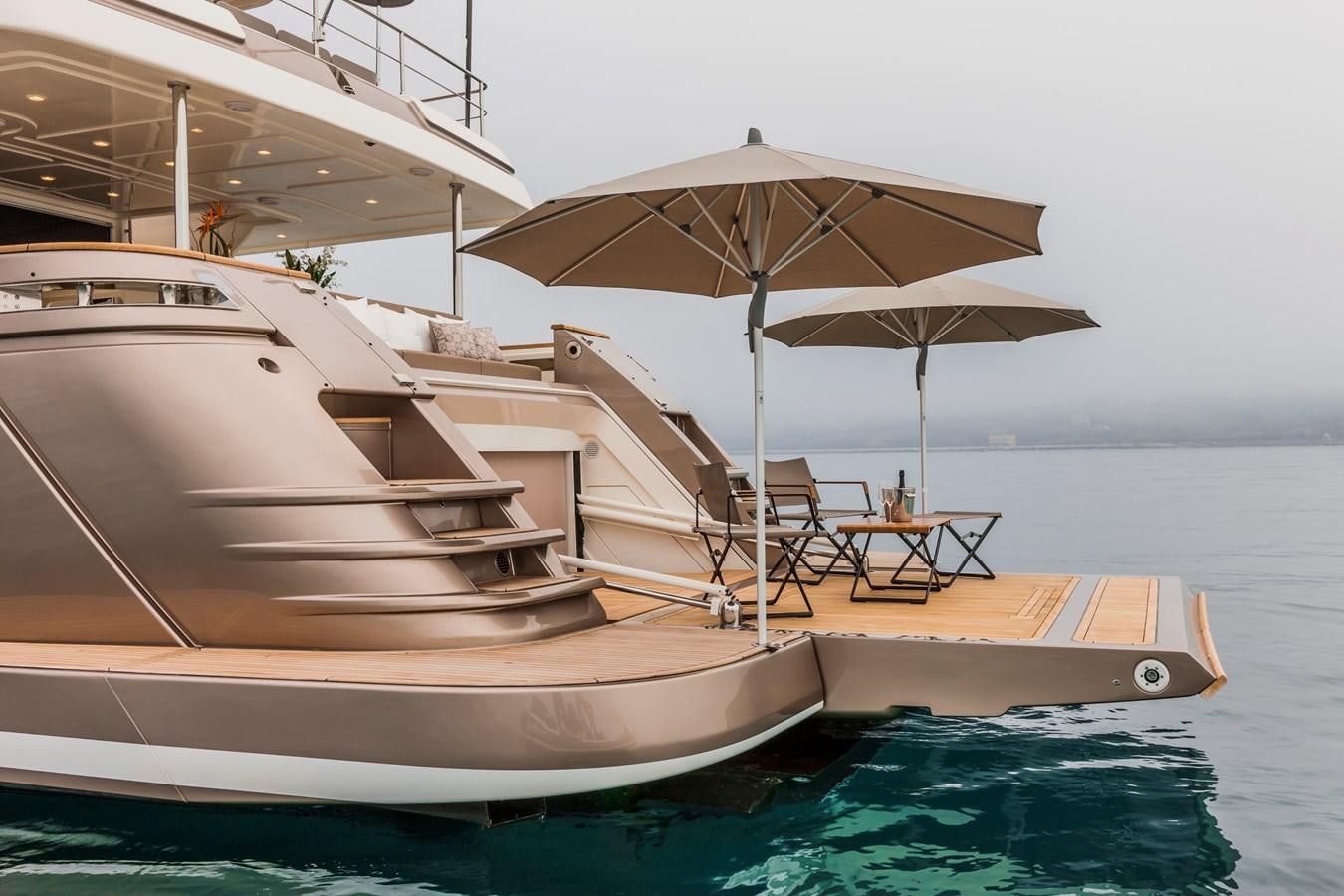 a boat with an umbrella aboard YVONNE Yacht for Sale