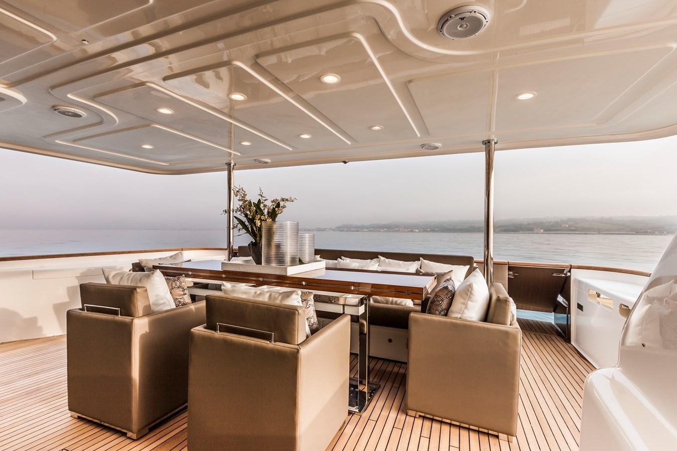 a room with a table and chairs aboard YVONNE Yacht for Sale