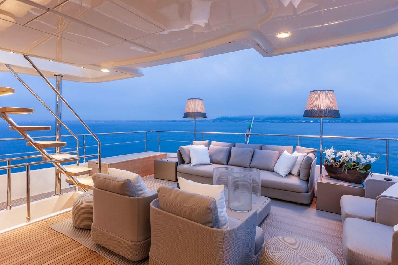 a living room with a large blue ocean aboard YVONNE Yacht for Sale