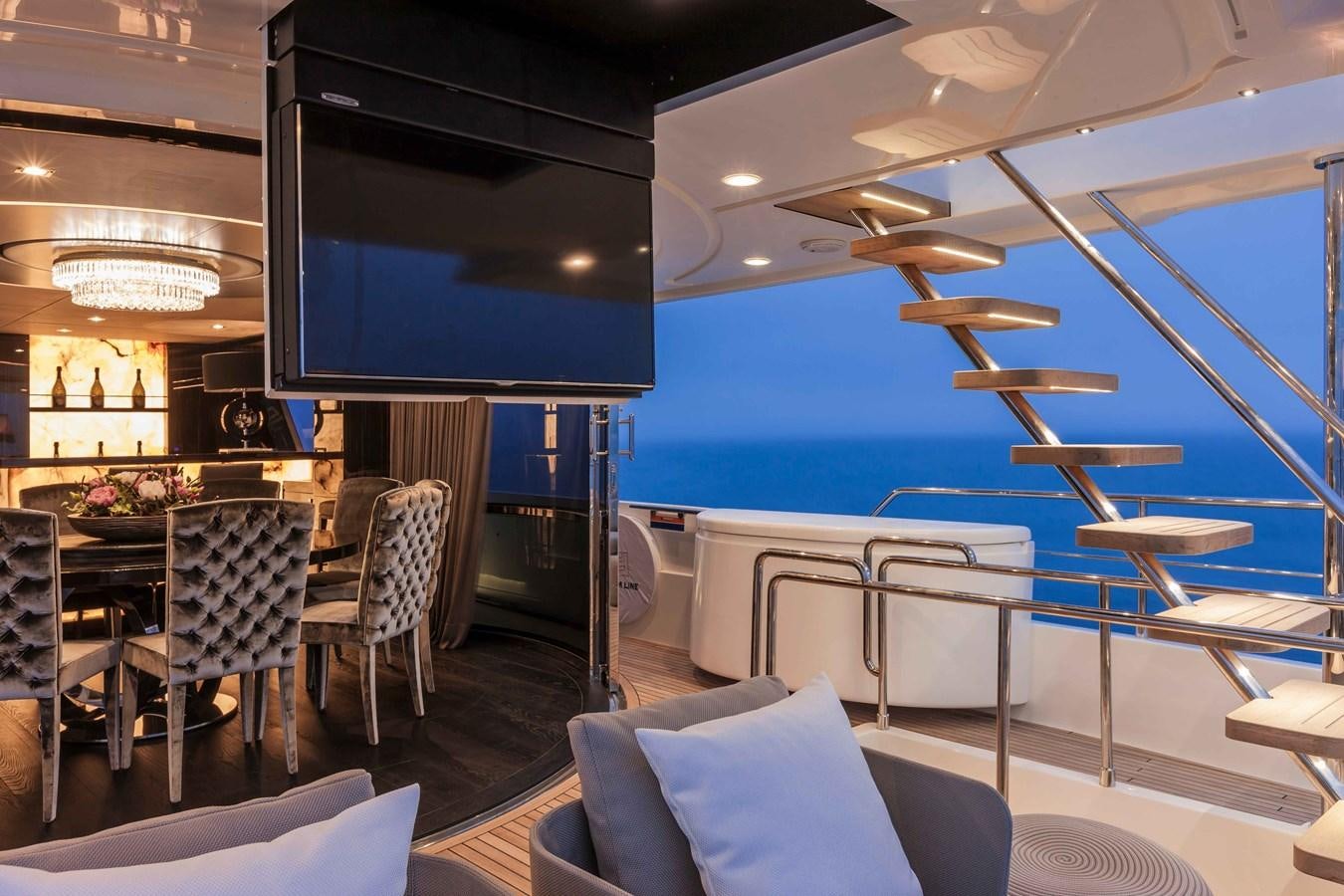a restaurant with a large screen aboard YVONNE Yacht for Sale