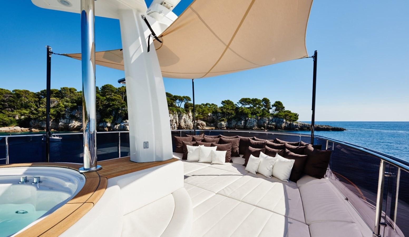 a large white bed on a balcony aboard YVONNE Yacht for Sale