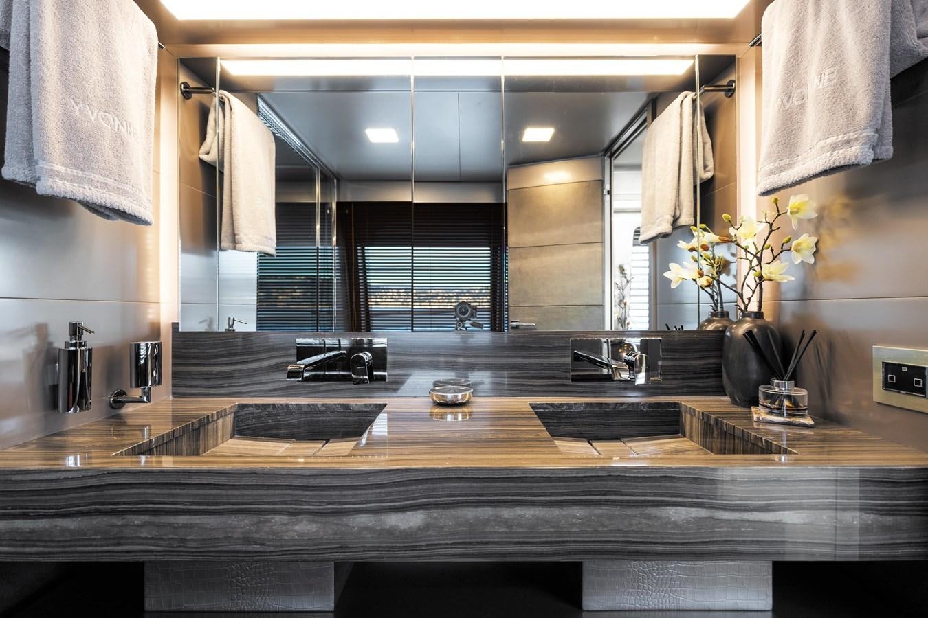 a large bathroom with a large countertop aboard YVONNE Yacht for Sale
