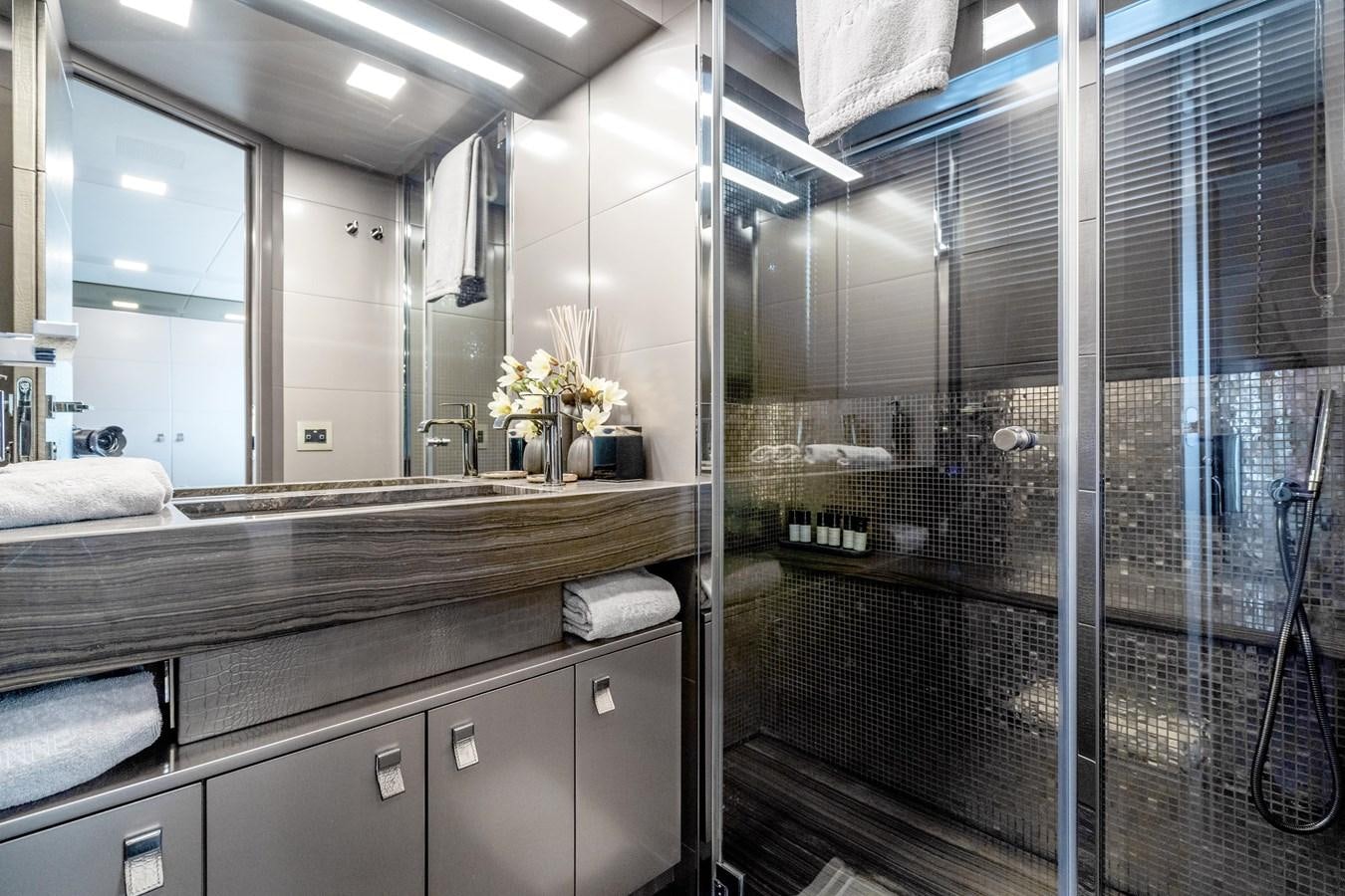 a bathroom with a large mirror aboard YVONNE Yacht for Sale