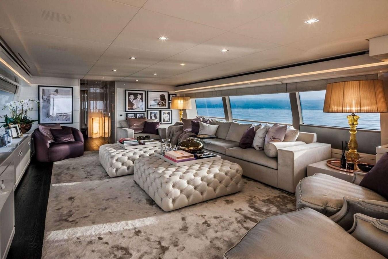 a living room with a large window aboard YVONNE Yacht for Sale