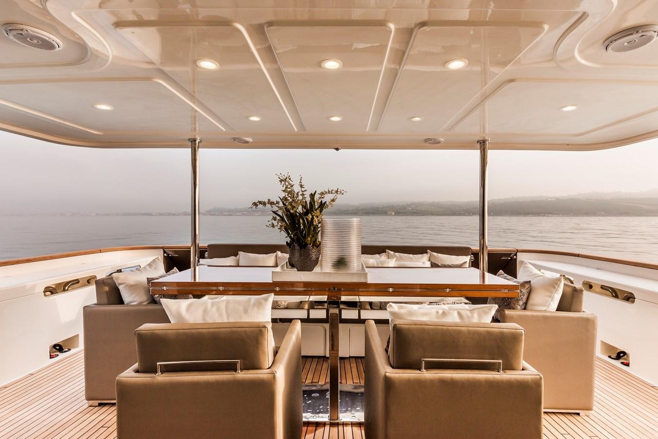 a room with a table and chairs aboard YVONNE Yacht for Sale