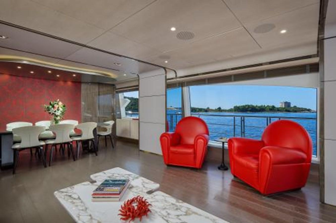 a room with tables and chairs aboard SILVIA Yacht for Sale