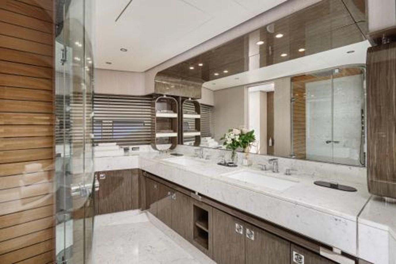 a bathroom with a large mirror aboard SILVIA Yacht for Sale