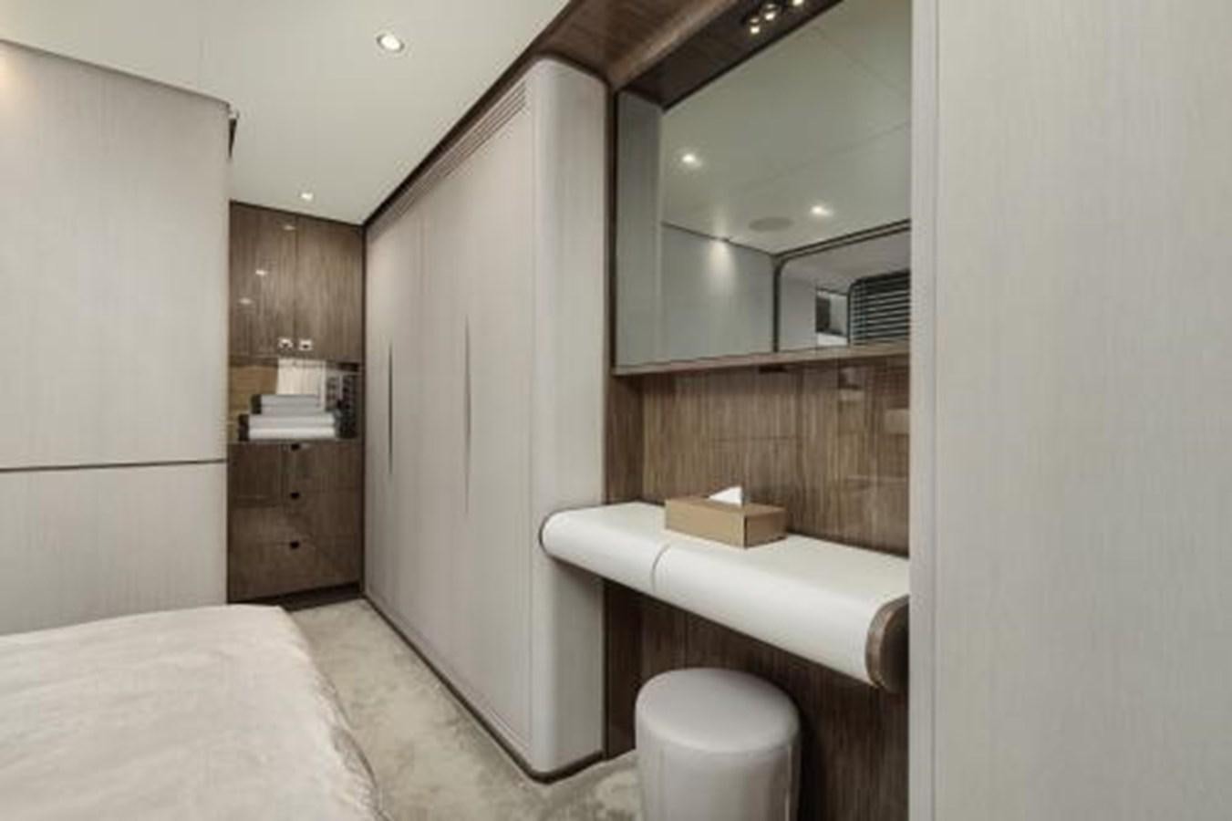 a bedroom with a bed and a mirror aboard SILVIA Yacht for Sale
