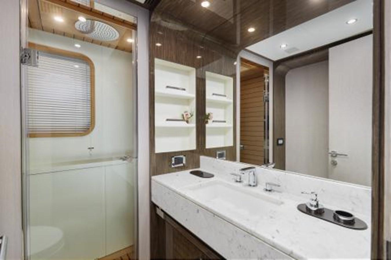 a bathroom with a large mirror aboard SILVIA Yacht for Sale